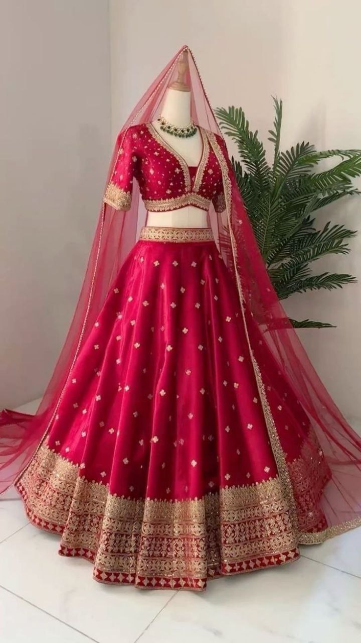Embroidered Raw Silk Lehenga Choli with Net Dupatta